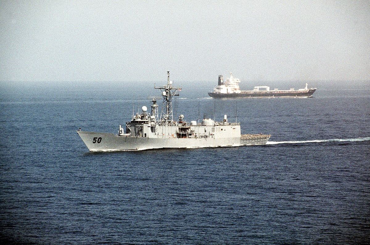 A US frigate passing a tanker in the Persian Gulf (1990).